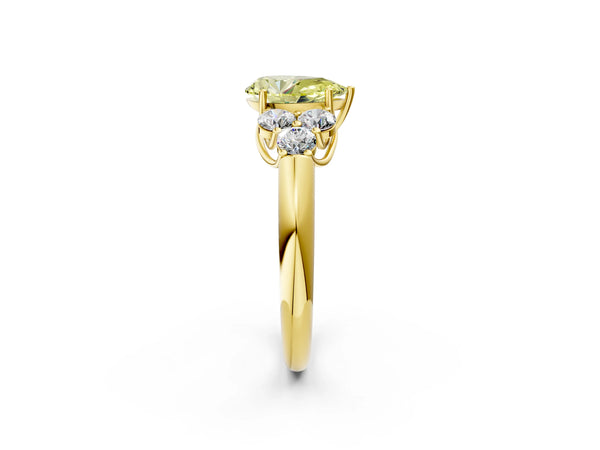 Yellow gold Fancy Yellow Pear  Cut Diamond Cluster Ring with Round Accent Stones and Prong Setting on a Classic Band