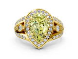Yellow gold Fancy Yellow Pear Cut Diamond Halo Ring with Split Shank and Bezel Accents and Four-Prong Setting