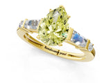 Yellow gold Fancy Yellow Pear  Cut Diamond Ring with Baguette Side Stones, Channel Set Band, and Four-Prong Setting_25