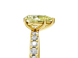Yellow gold Fancy Yellow Pear  Cut Diamond Solitaire with Pave Band and Four-Prong Setting