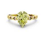 Yellow gold Fancy Yellow Pear Cut Solitaire Diamond Ring with Infinity Twist Band and Four-Prong Setting