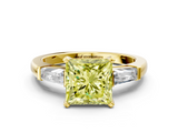 Yellow gold Fancy Yellow Princess  Solitaire with Tapered Baguette Side Stones on a Classic Band with Four-Prong Setting