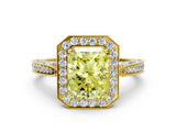 Yellow gold Fancy Yellow Radiant Cut Halo Diamond Engagement Ring with Split Shank Band and Four-Prong Setting