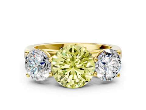Yellow gold Fancy Yellow Round Cut Three-Stone Diamond Ring with Prong Setting on a Classic Band