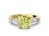 Yellow gold Fancy Yellow Round  Solitaire with Tapered Baguette Side Stones on a Classic Band with Four-Prong Setting