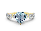 Yellow gold Heart Cut Aquamarine Prong Setting with Side Stones on a Pave Band