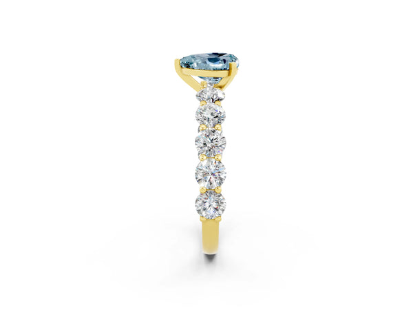 Yellow gold Heart Cut Aquamarine Prong Setting with Side Stones on a Pave Band