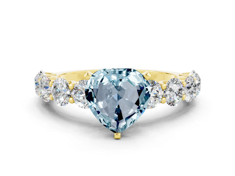 Yellow gold Heart Cut Aquamarine Prong Setting with Side Stones on a Pave Band