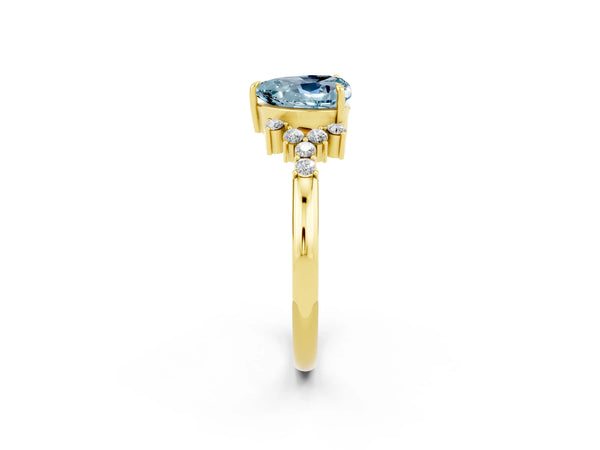 Yellow gold Heart Cut Aquamarine Ring with Side Stones and Four-Prong Setting