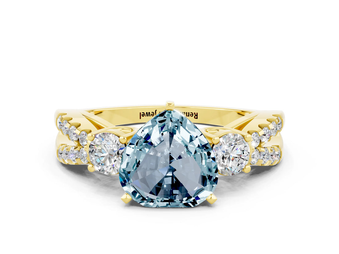 Yellow gold Heart Cut Aquamarine Three-Stone Ring with Pavé Split Shank and Four-Prong Setting