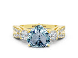 Yellow gold Heart Cut Aquamarine Three-Stone Ring with Pavé Split Shank and Four-Prong Setting