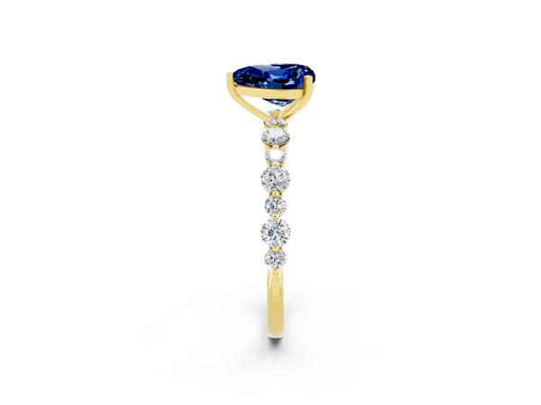 Yellow gold Heart Cut Blue Sapphire Prong Set Engagement Ring with Pavé Band