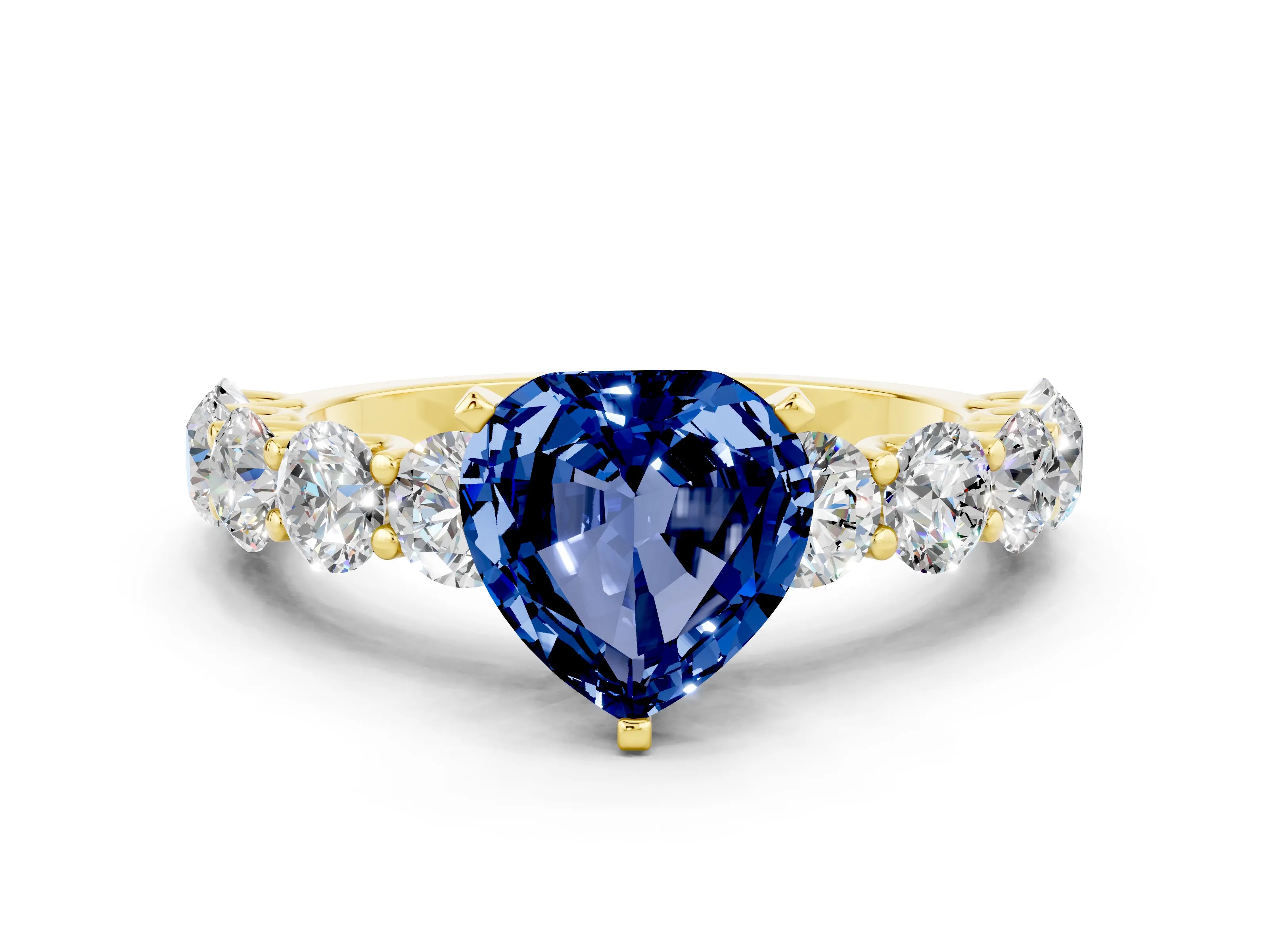 Yellow gold Heart Cut Blue Sapphire Prong Setting with Side Stones on a Pave Band