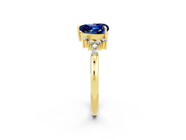 Yellow gold Heart Cut Blue Sapphire Ring with Side Stones and Four-Prong Setting