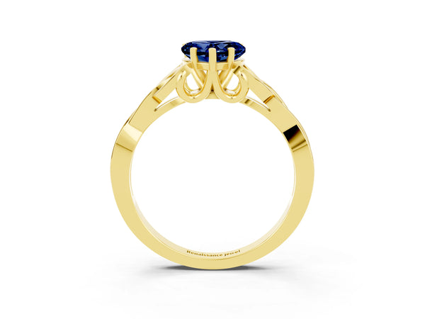 Yellow gold Heart Cut Blue Sapphire Solitaire Engagement Ring with Celtic Knot Band and Four-Prong Setting