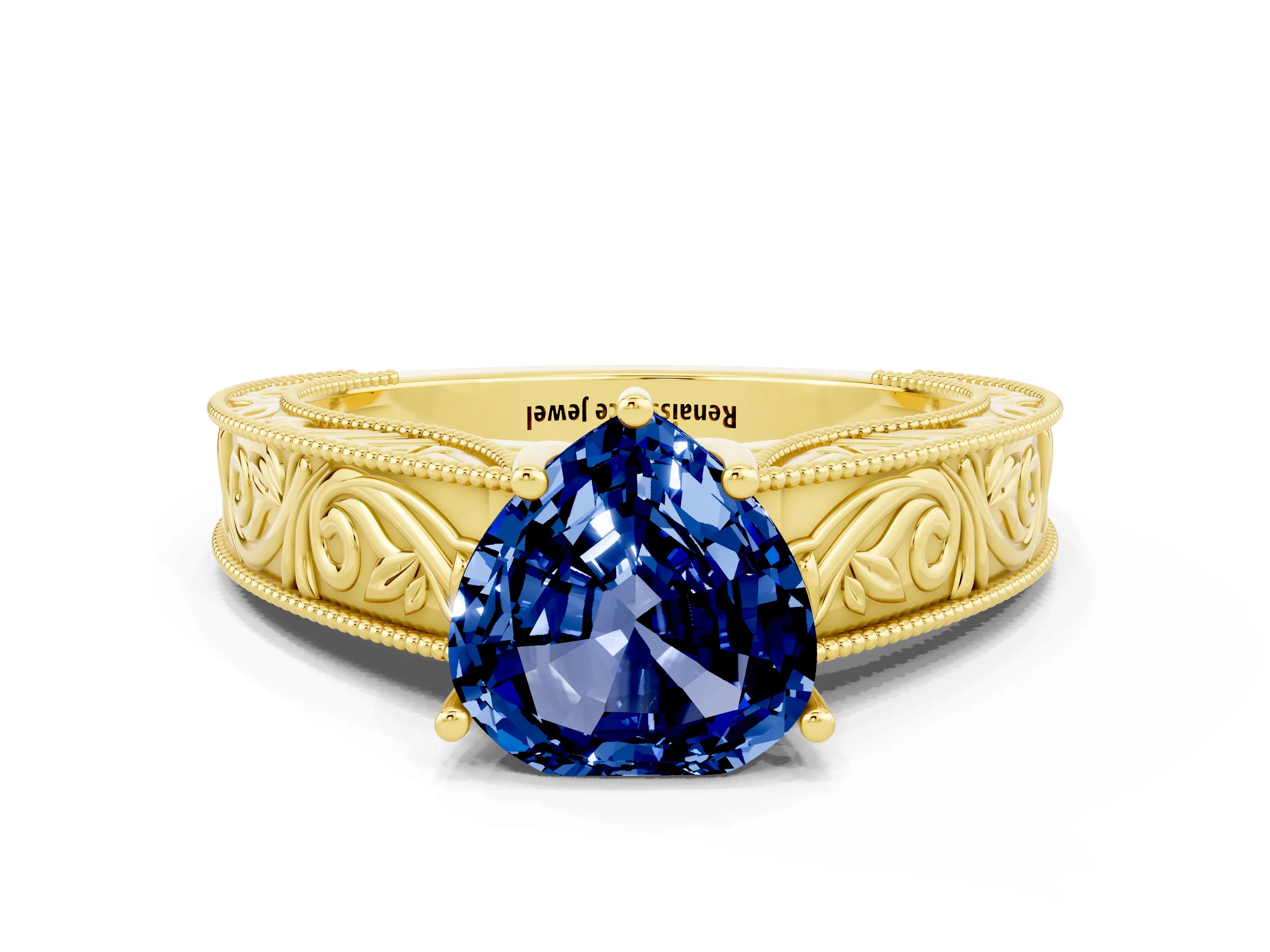 Yellow gold Heart Cut Blue Sapphire Solitaire Ring with Engraved Band and Four-Prong Setting