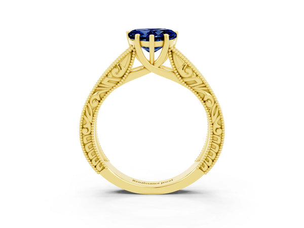 Yellow gold Heart Cut Blue Sapphire Solitaire Ring with Engraved Band and Four-Prong Setting