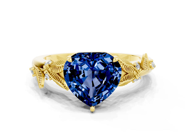Yellow gold Heart Cut Blue Sapphire Solitaire Ring with Leaf Motif Band and Four-Prong Setting