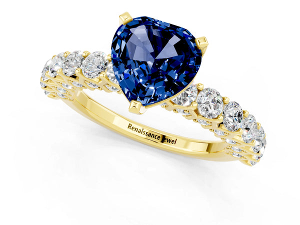 Yellow gold Heart Cut Blue Sapphire Solitaire Ring with Shared Prong Pavé Band and Four-Prong Setting