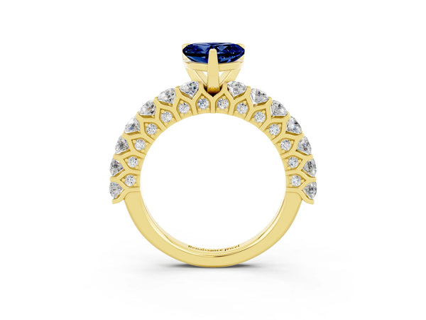 Yellow gold Heart Cut Blue Sapphire Solitaire Ring with Shared Prong Pavé Band and Four-Prong Setting