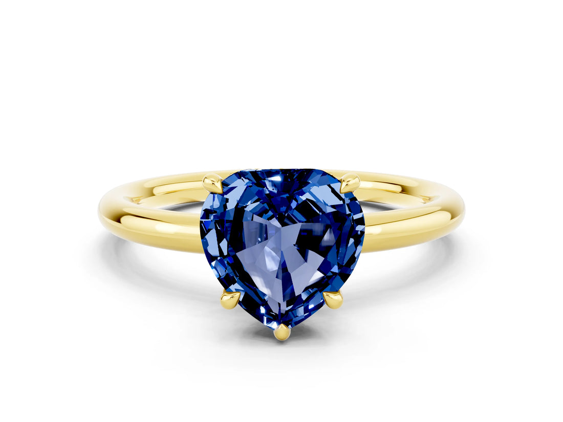 Yellow gold Heart Cut Blue Sapphire Solitaire Ring with Thin Band and Four-Prong Setting
