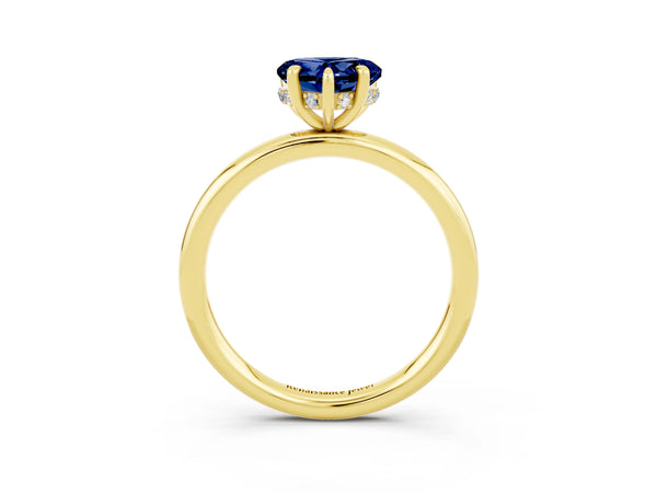 Yellow gold Heart Cut Blue Sapphire Solitaire Ring with Thin Band and Four-Prong Setting