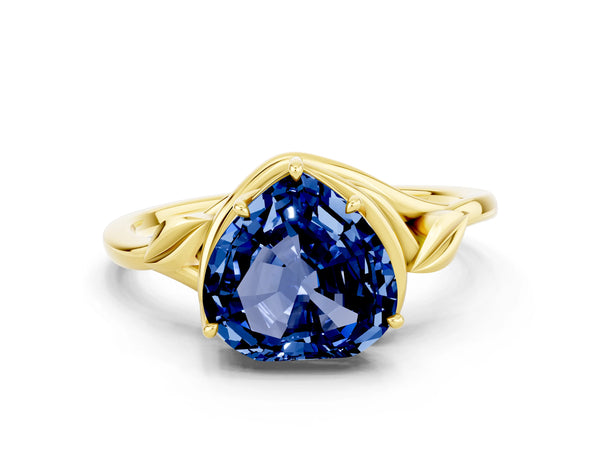 Yellow gold Heart Cut Blue Sapphire Solitaire Ring with Twist Band and Four-Prong Setting