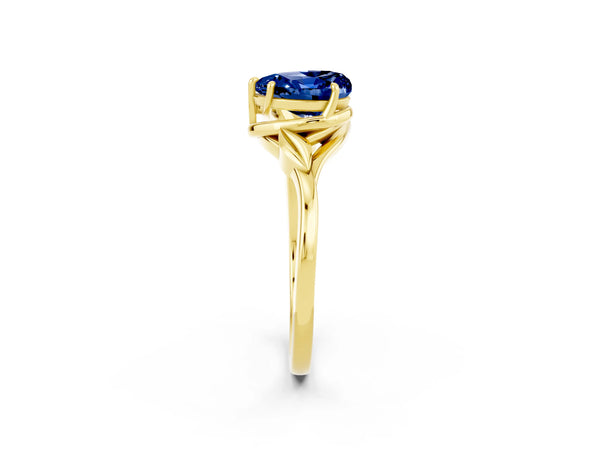 Yellow gold Heart Cut Blue Sapphire Solitaire Ring with Twist Band and Four-Prong Setting