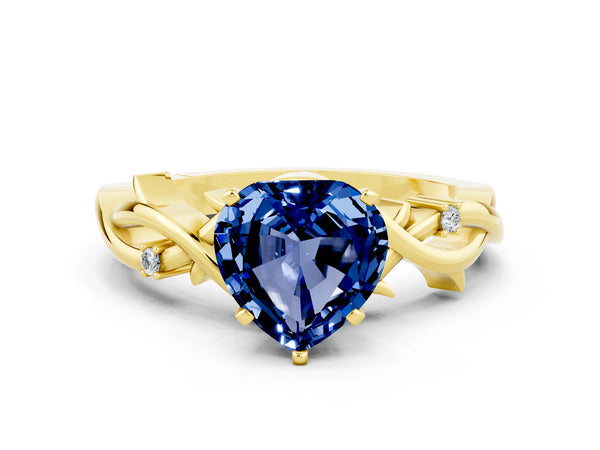 Yellow gold Heart Cut Blue Sapphire Solitaire Ring with Twisted Band and Prong Setting
