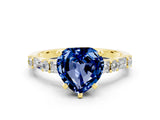 Yellow gold Heart Cut Blue Sapphire Solitaire with Side Baguettes and Channel Set Band