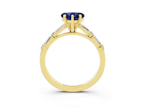 Yellow gold Heart Cut Blue Sapphire Solitaire with Side Baguettes and Channel Set Band