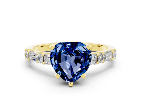 Yellow gold Heart Cut Blue Sapphire Solitaire with Side Baguettes and Channel Set Band