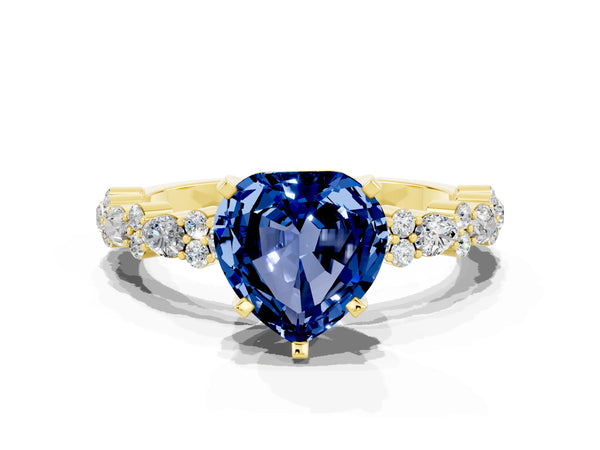 Yellow gold Heart Cut Blue Sapphire Side Stone Solitaire Ring with Round  and Four-Prong Setting