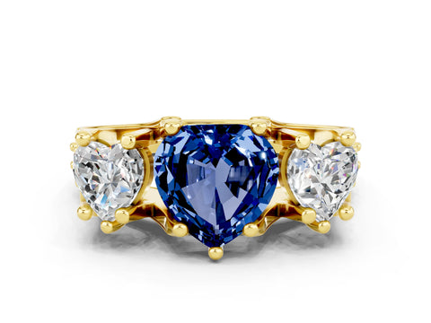 Yellow gold Heart Cut Blue Sapphire Three-Stone Ring with Channel Set Band and Four-Prong Setting