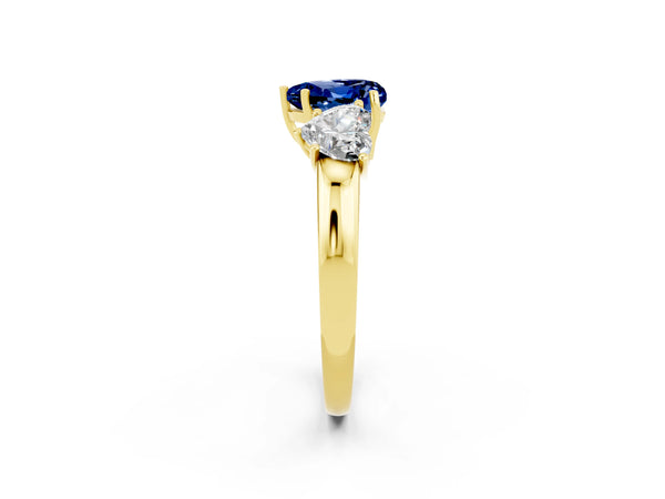 Yellow gold Heart Cut Blue Sapphire Three-Stone Ring with Four-Prong Setting and Classic Band