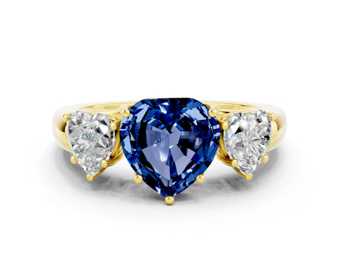 Yellow gold Heart Cut Blue Sapphire Three-Stone Ring with Four-Prong Setting and Classic Band