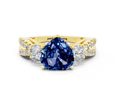 Yellow gold Heart Cut Blue Sapphire Three-Stone Ring with Pavé Split Shank and Four-Prong Setting
