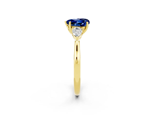 Yellow gold Heart Cut Blue Sapphire Three-Stone Ring with Pear  Side Stones and Prong Setting