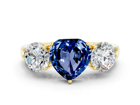 Yellow gold Heart Cut Blue Sapphire Three-Stone Ring with Prong Setting and Classic Band
