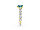Yellow gold Heart Cut Blue Topaz Prong Setting with Side Stones on a Pave Band_2