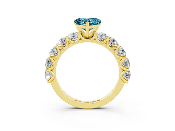 Yellow gold Heart Cut Blue Topaz Prong Setting with Side Stones on a Pave Band