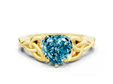 Yellow gold Heart Cut Blue Topaz Solitaire Engagement Ring with Celtic Knot Band and Four-Prong Setting