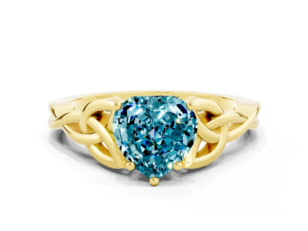 Yellow gold Heart Cut Blue Topaz Solitaire Engagement Ring with Celtic Knot Band and Four-Prong Setting
