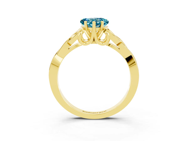 Yellow gold Heart Cut Blue Topaz Solitaire Engagement Ring with Celtic Knot Band and Four-Prong Setting