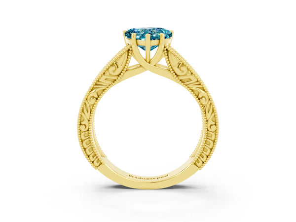 Yellow gold Heart Cut Blue Topaz Solitaire Ring with Engraved Band and Four-Prong Setting