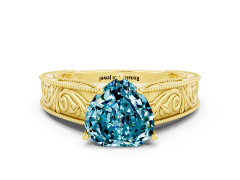 Yellow gold Heart Cut Blue Topaz Solitaire Ring with Engraved Band and Four-Prong Setting