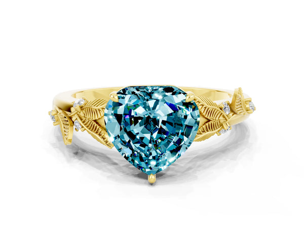 Yellow gold Heart Cut Blue Topaz Solitaire Ring with Leaf Motif Band and Four-Prong Setting