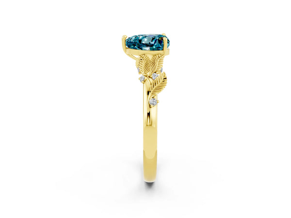 Yellow gold Heart Cut Blue Topaz Solitaire Ring with Leaf Motif Band and Four-Prong Setting