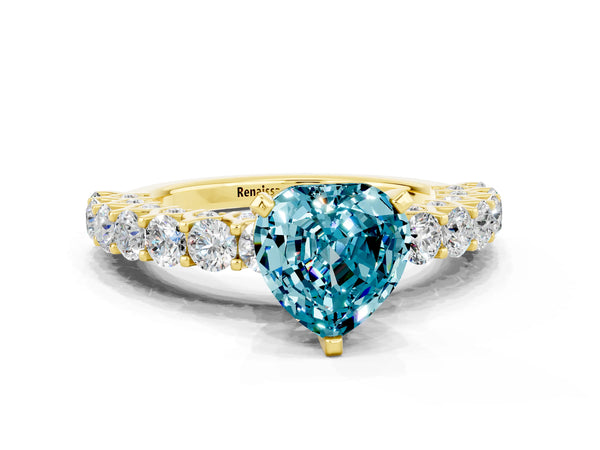 Yellow gold Heart Cut Blue Topaz Solitaire Ring with Shared Prong Pavé Band and Four-Prong Setting