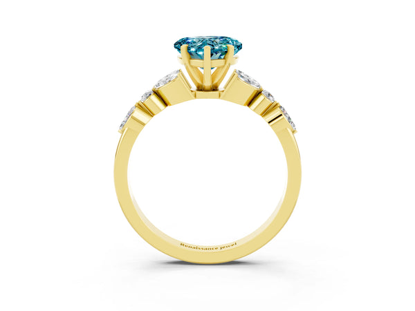 Yellow gold Heart Cut Blue Topaz Solitaire Ring with Side Stones and Four-Prong Setting